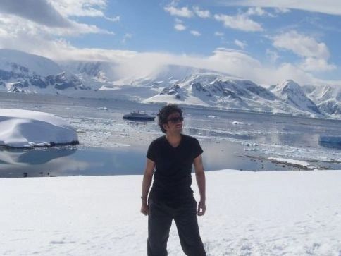 Apurv standing on the snow in Antarctica